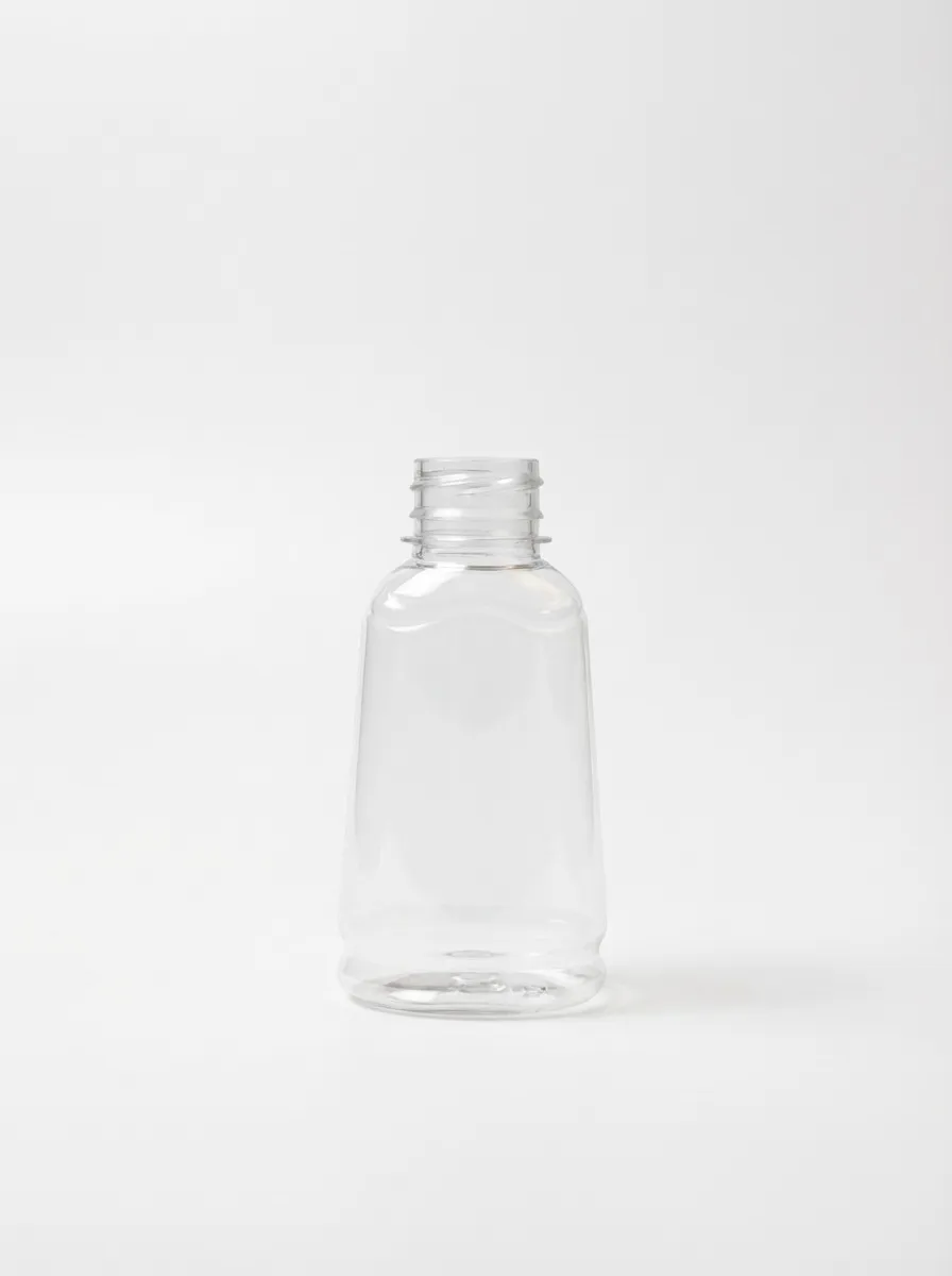 Small clear PET bottle with wide tapered body